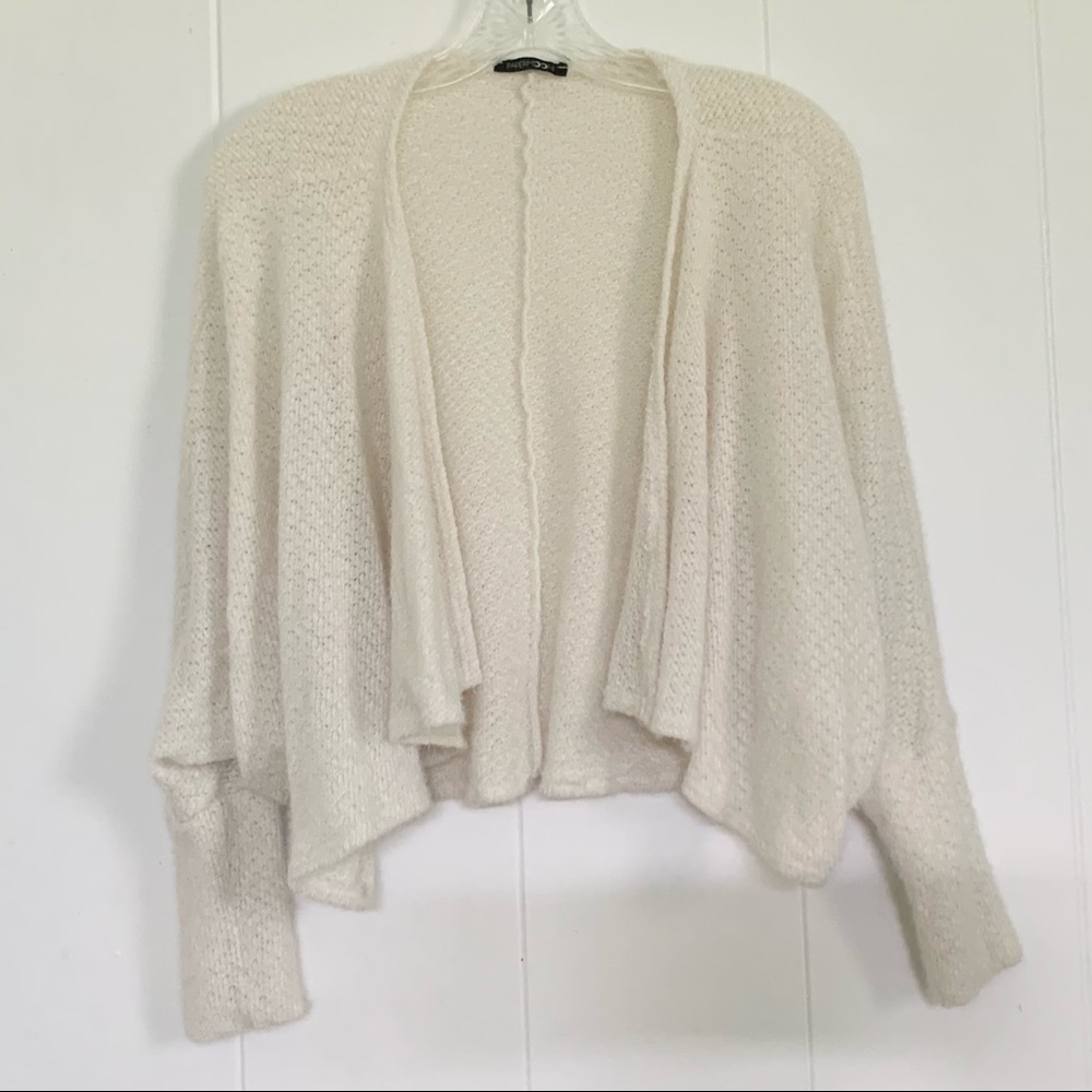 cream colored cardigan